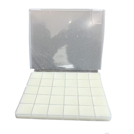 A sealed container holding white ketamine troches, a solid research chemical for laboratory use.